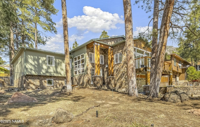 exterior space with stone siding