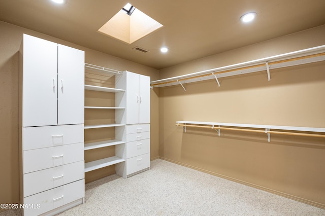 spacious closet featuring a skylight and visible vents