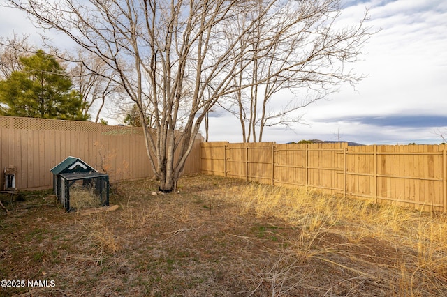 view of yard with a fenced backyard