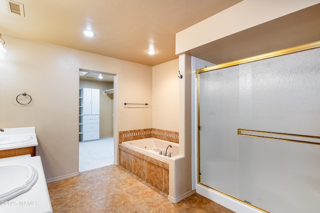 full bath with a bath, a stall shower, a sink, and visible vents