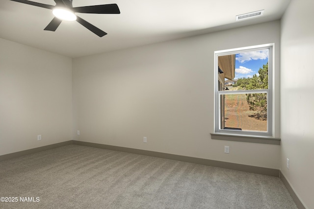 unfurnished room with light carpet and ceiling fan