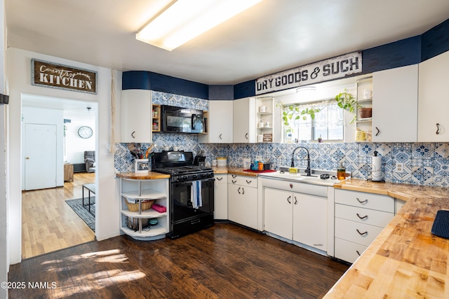 502 N Humbolt St, Williams, AZ 86046 - kitchen with open shelves, wood counters, black appliances, and a sink