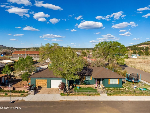 502 N Humbolt St, Williams, AZ 86046 - ranch-style house with a fenced front yard and a garage