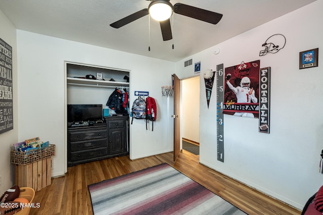 502 N Humbolt St, Williams, AZ 86046 - bedroom featuring wood finished floors, a closet, baseboards, and a ceiling fan