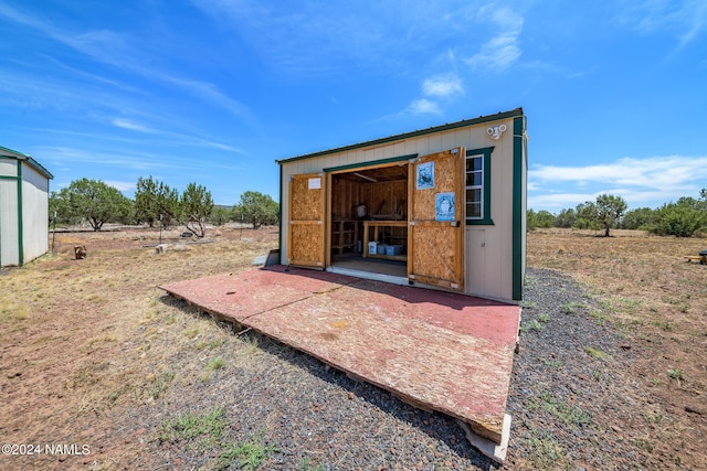 view of outbuilding with a rural view