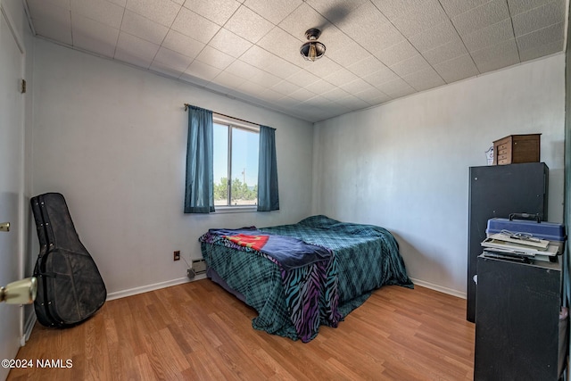 bedroom featuring hardwood / wood-style flooring