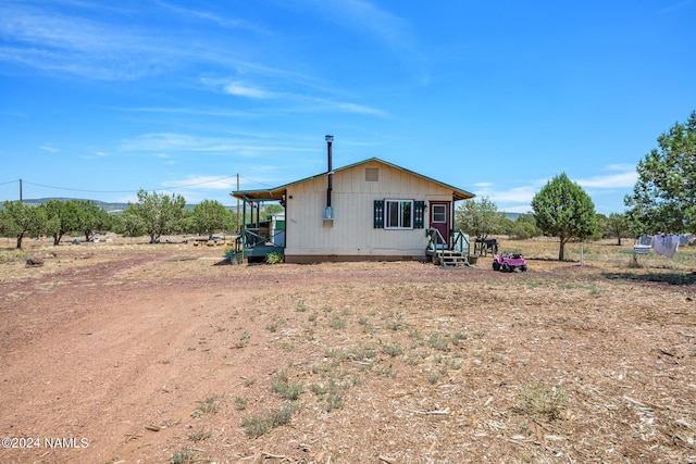 view of home's exterior featuring a rural view