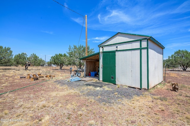 view of outdoor structure with a rural view