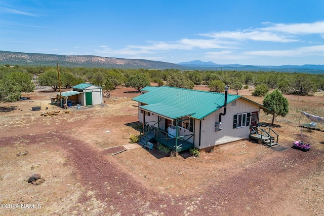 birds eye view of property featuring a mountain view