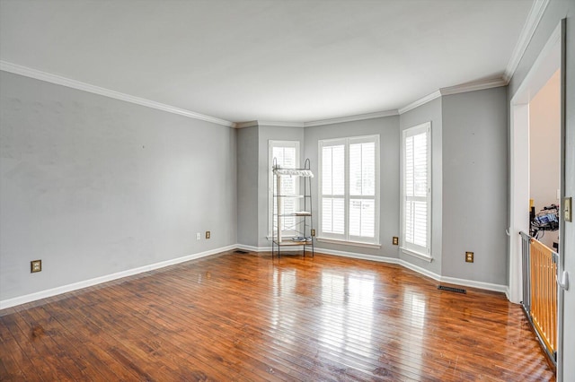 unfurnished room featuring dark hardwood / wood-style floors and ornamental molding