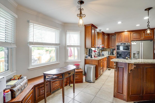 kitchen with pendant lighting, black double oven, light tile patterned floors, stainless steel fridge with ice dispenser, and light stone counters