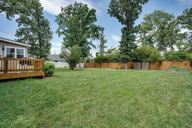 view of yard with a wooden deck