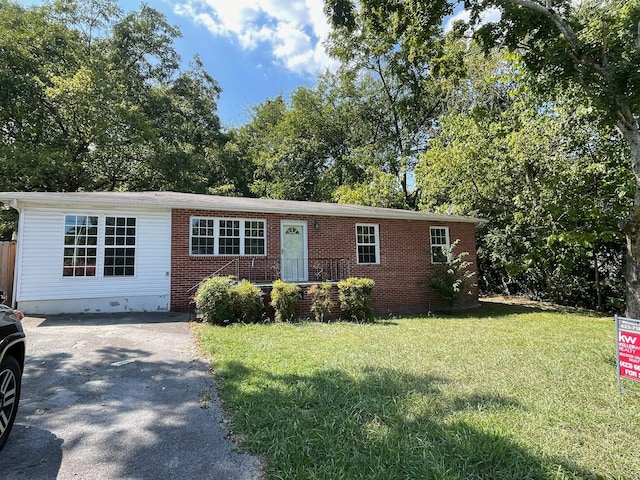 ranch-style house with a front lawn