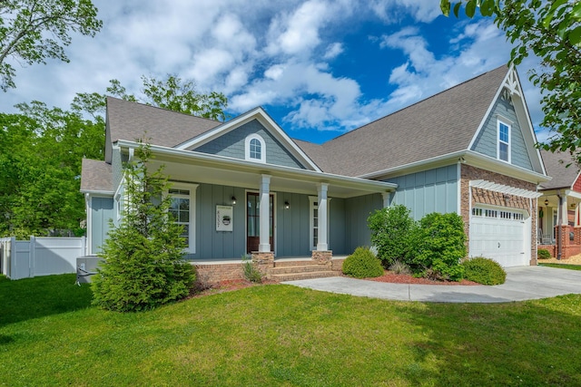 8337 Glenshire Ln, Chattanooga, TN 37421 - view of front of property featuring concrete driveway, fence, board and batten siding, a front yard, and covered porch