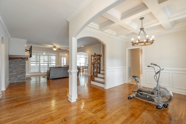 8337 Glenshire Ln, Chattanooga, TN 37421 - interior space with light wood-style flooring, ceiling fan with notable chandelier, arched walkways, and ornamental molding