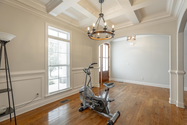 8337 Glenshire Ln, Chattanooga, TN 37421 - workout area featuring light wood-type flooring, an inviting chandelier, ornamental molding, arched walkways, and visible vents