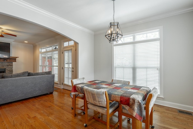 8337 Glenshire Ln, Chattanooga, TN 37421 - dining space with arched walkways, visible vents, light wood-type flooring, and plenty of natural light