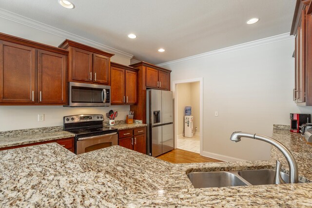 8337 Glenshire Ln, Chattanooga, TN 37421 - kitchen with crown molding, a sink, light stone countertops, appliances with stainless steel finishes, and recessed lighting