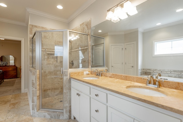 bathroom featuring a shower with door, vanity, and crown molding