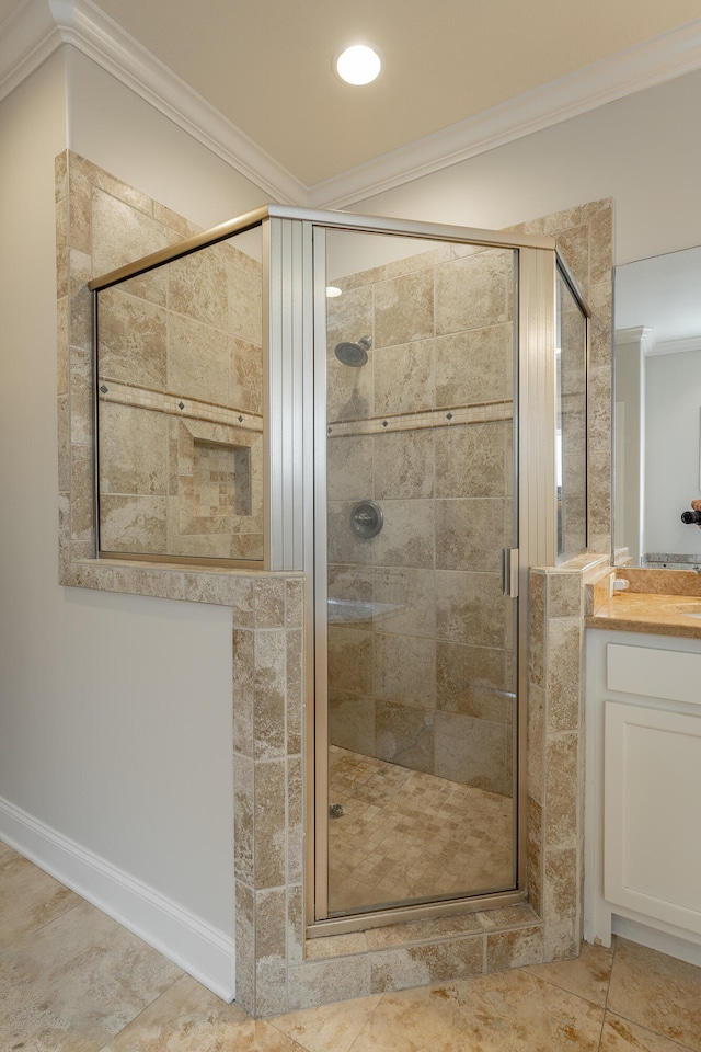 bathroom with tile patterned floors, walk in shower, crown molding, and vanity