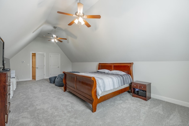 carpeted bedroom with vaulted ceiling and ceiling fan