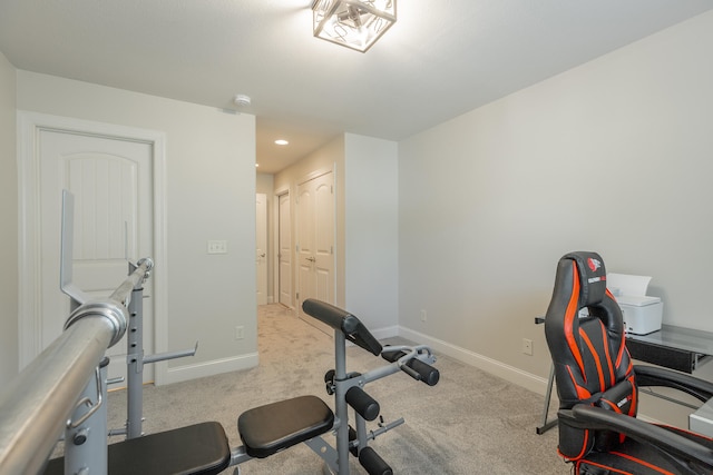 exercise room with light carpet