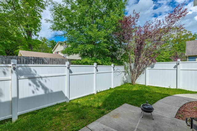 8337 Glenshire Ln, Chattanooga, TN 37421 - view of yard featuring a fenced backyard, a fire pit, and a patio area