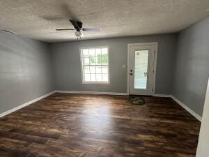 spare room featuring a textured ceiling and ceiling fan