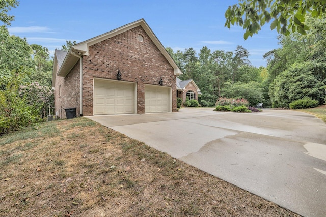 view of side of home featuring a garage