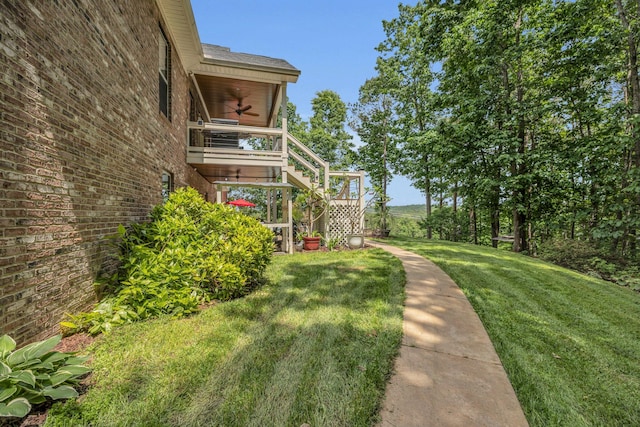 view of yard featuring ceiling fan