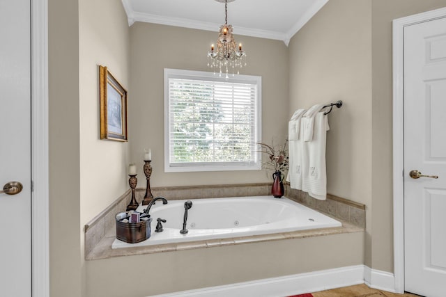 bathroom featuring crown molding, a bathing tub, and an inviting chandelier