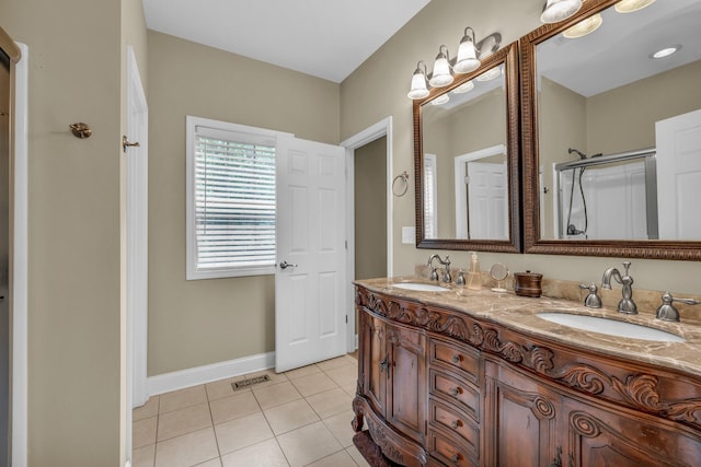 bathroom with vanity, walk in shower, and tile patterned floors