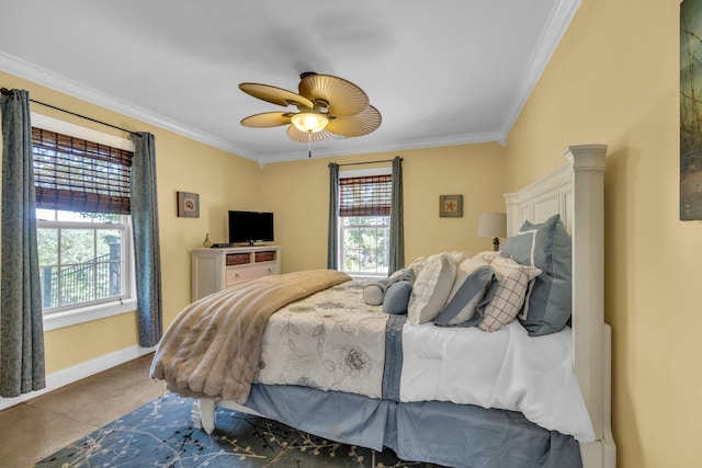 bedroom with ceiling fan and crown molding