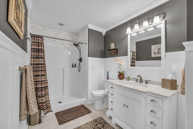 bathroom with toilet, tile patterned floors, ornamental molding, vanity, and a shower with curtain