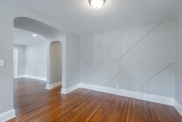 empty room with wood-type flooring