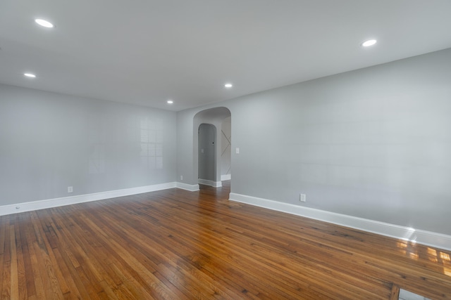 empty room with dark hardwood / wood-style floors