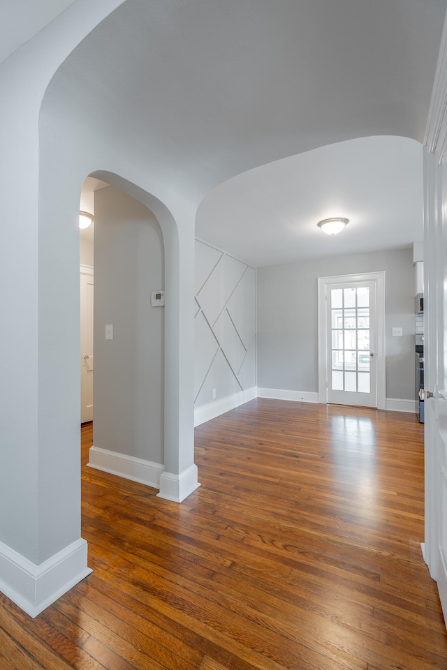 unfurnished living room featuring hardwood / wood-style floors