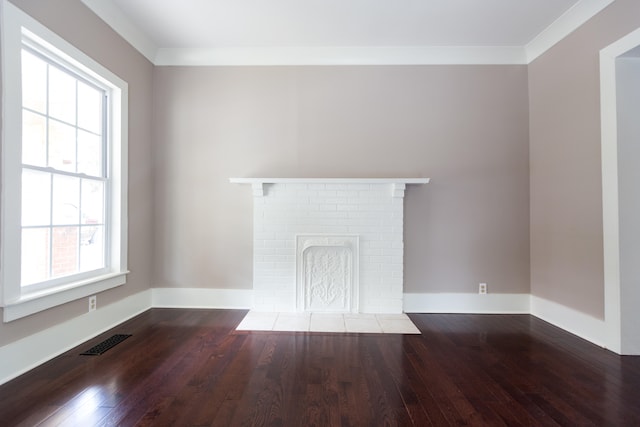 unfurnished living room with a fireplace, crown molding, and hardwood / wood-style flooring