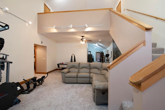 living room featuring high vaulted ceiling, light colored carpet, ceiling fan, and track lighting