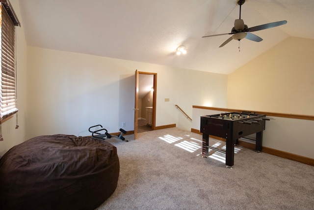 rec room with carpet floors, lofted ceiling, and ceiling fan