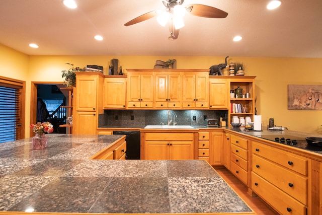 kitchen with black appliances, backsplash, light brown cabinets, sink, and ceiling fan