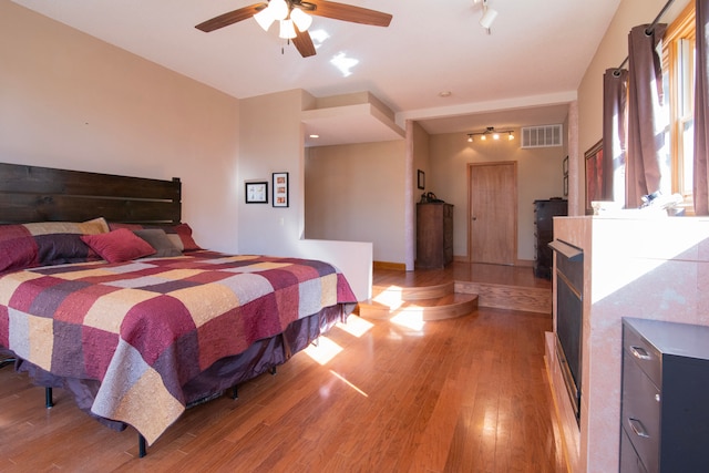 bedroom featuring hardwood / wood-style floors and ceiling fan