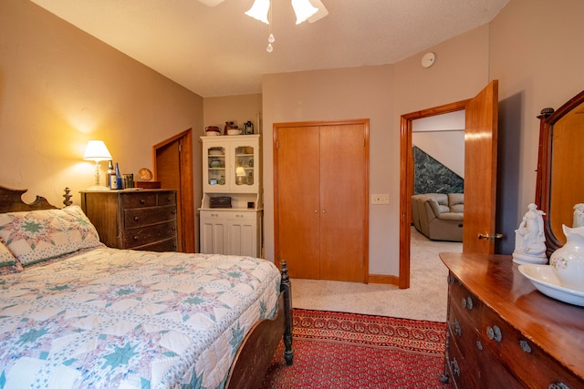 carpeted bedroom with ceiling fan