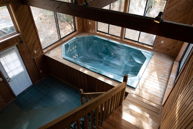 misc room featuring wood walls and hardwood / wood-style flooring