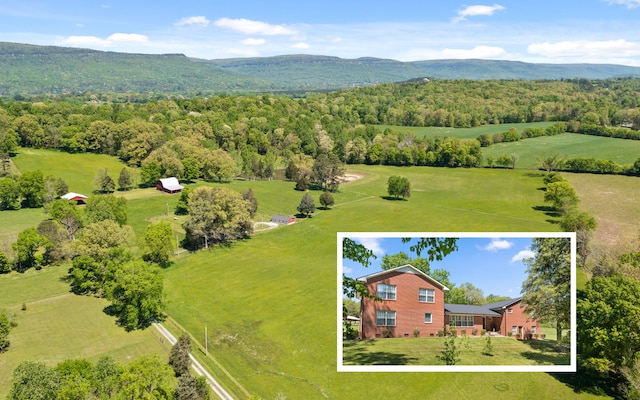 aerial view featuring a rural view and a mountain view