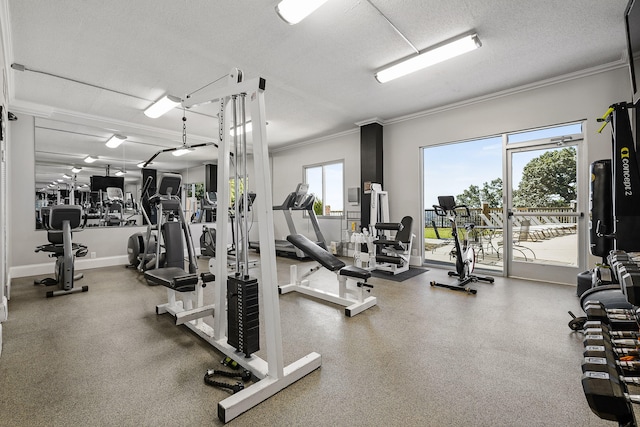 gym with a textured ceiling and ornamental molding