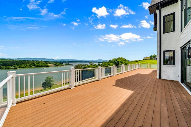 wooden terrace with a water view