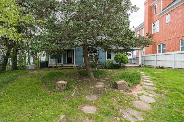 view of yard featuring covered porch