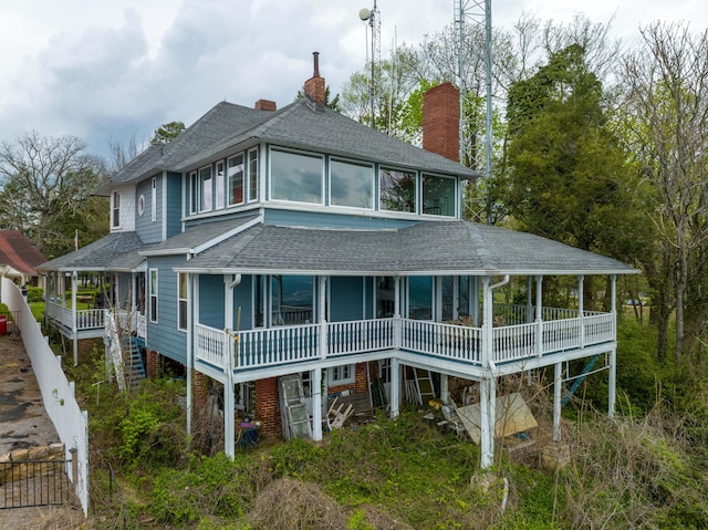 rear view of house with covered porch