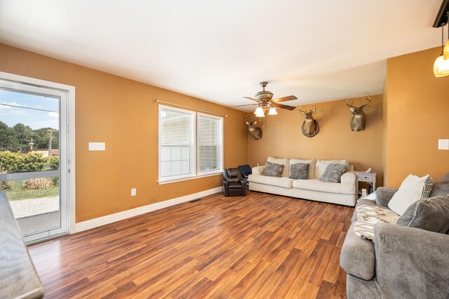 living room featuring a wealth of natural light, ceiling fan, and hardwood / wood-style flooring